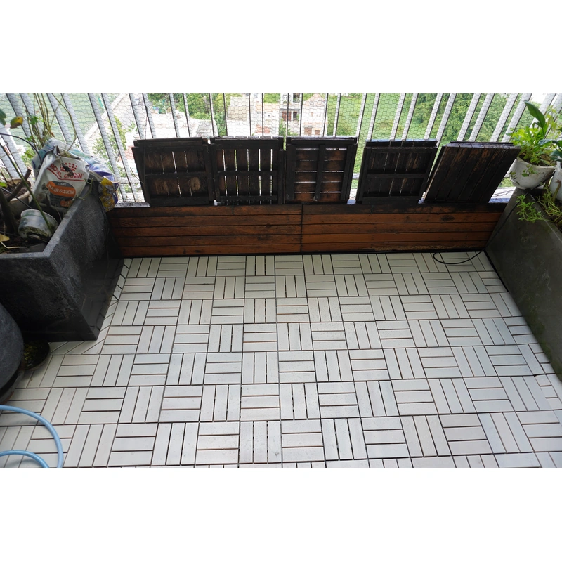 Outdoor Patio Tiles Over Concrete for Balcony 5 White twelve-slat wood tiles installed across a planted balcony floor
