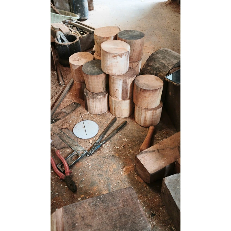 Faceted Loop Wooden Cup – Doussie Wood 6 Round wooden blanks and tools in a workshop