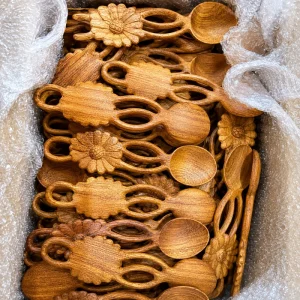 Carved floral wooden spoons with openwork handles in protective packing