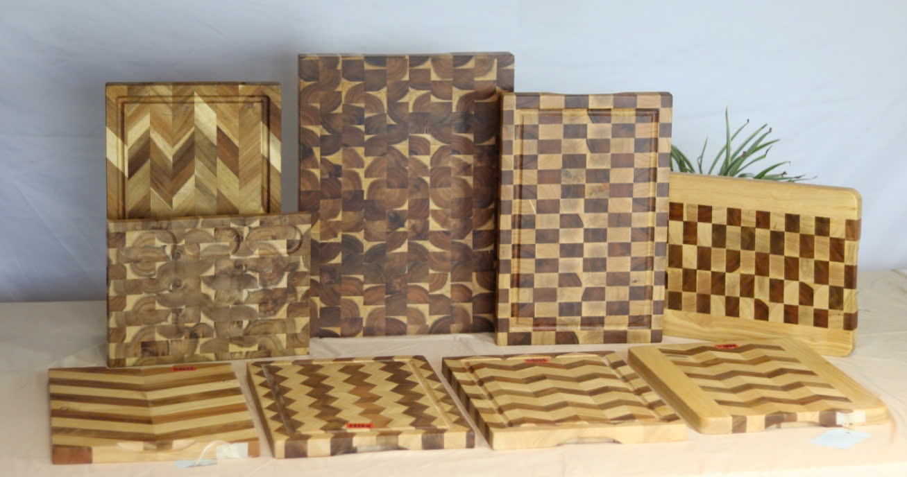 Collection of patterned wooden cutting boards in assorted designs