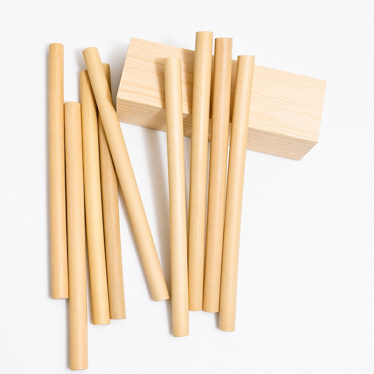 Natural bamboo drinking straws arranged on a white background