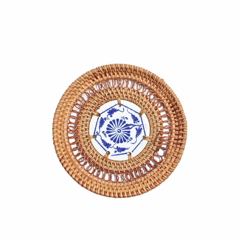 Rattan coaster with blue and white ceramic centre Rattan coaster with blue and white ceramic centre