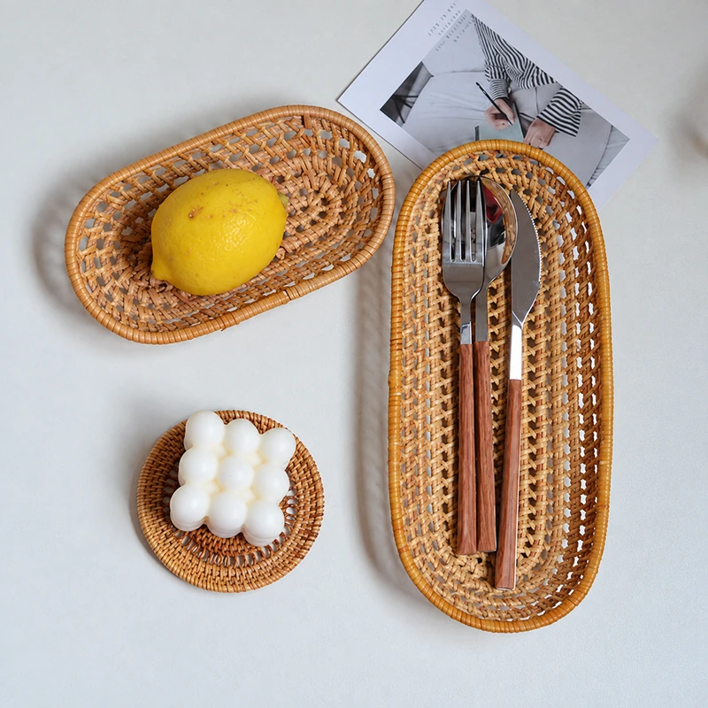Oval Rattan Basket | 2 Handwoven Sizes 3 Oval rattan basket styled with cutlery and a lemon