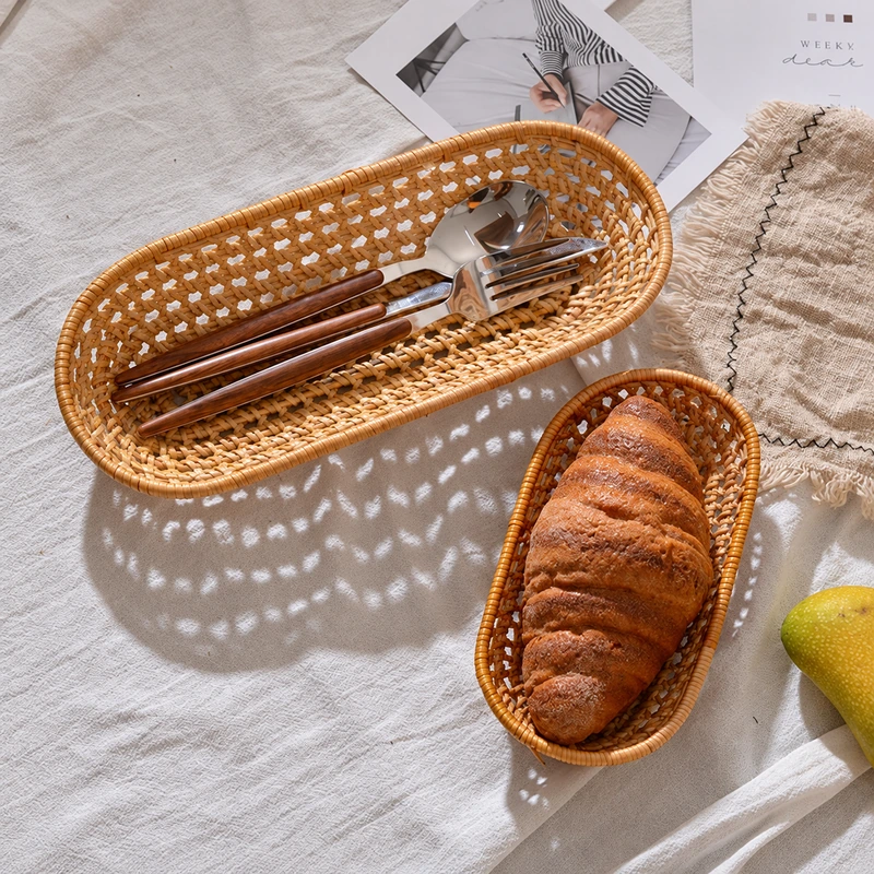 Oval Rattan Basket | 2 Handwoven Sizes 4 Two oval baskets styled with cutlery and bread