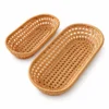 Oval Rattan Basket | 2 Handwoven Sizes 9 Two empty oval rattan baskets on white