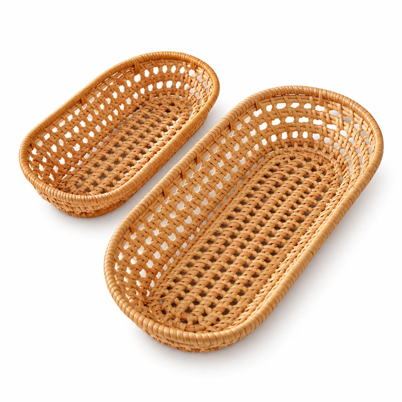 Two empty oval rattan baskets on white Two empty oval rattan baskets on white