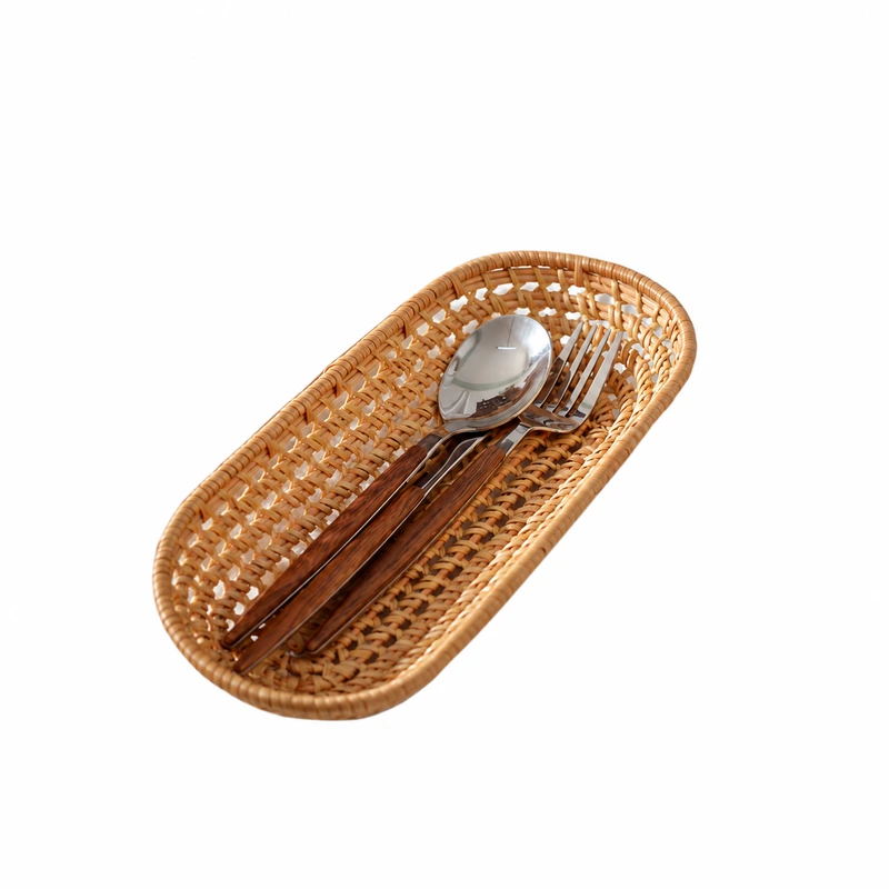 Long oval basket holding wooden-handled cutlery Long oval basket holding wooden-handled cutlery