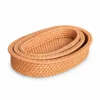 Oval Nesting Rattan Baskets | Set of 3 3 oval nesting rattan baskets on a white background