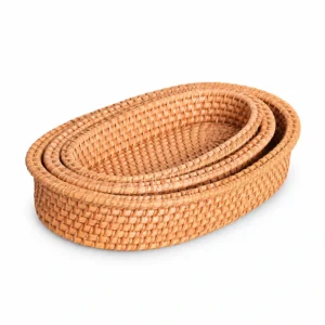 oval nesting rattan baskets on a white background