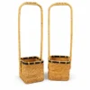 Long Handle Rattan Baskets | 2 Forms 3 long handle rattan baskets on a white background