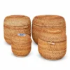 barrel shaped rattan baskets on a white background