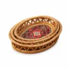 oval openwork rattan trays on a white background