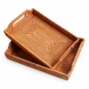 Rectangular Handled Rattan Trays | 2 Sizes 3 rectangular handled rattan trays on a white background