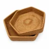 hexagonal rattan storage baskets on a white background