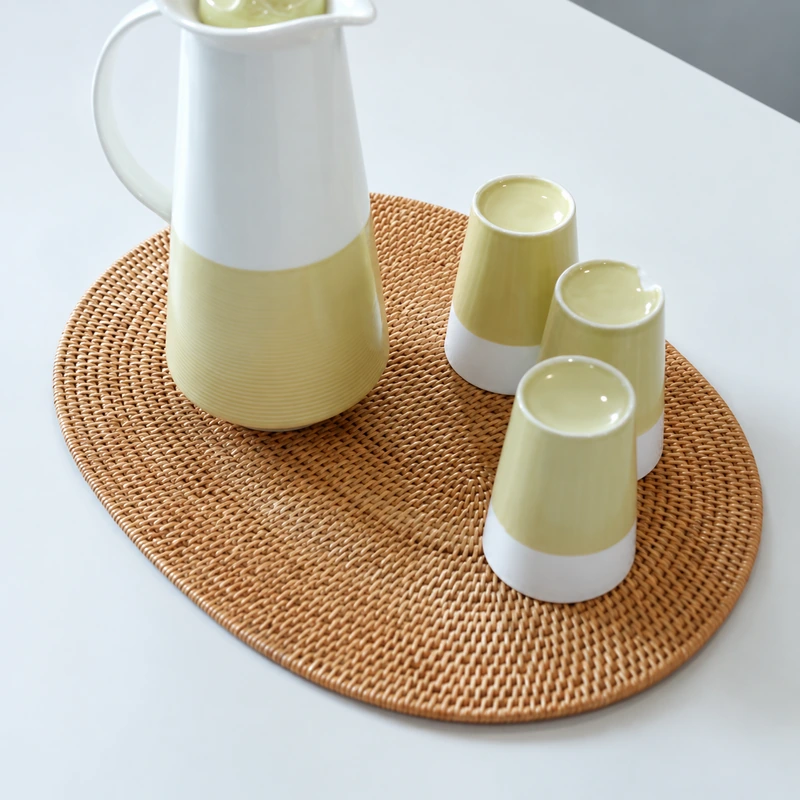 oval rattan table mat product photograph