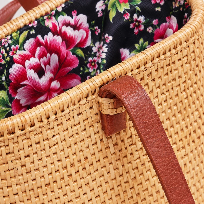 floral lined rattan shoulder bag construction and carrying detail