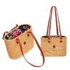 floral lined rattan shoulder bag on a white background